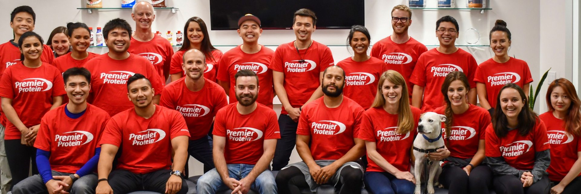 A group of Premier Protein employees and Scout the dog!