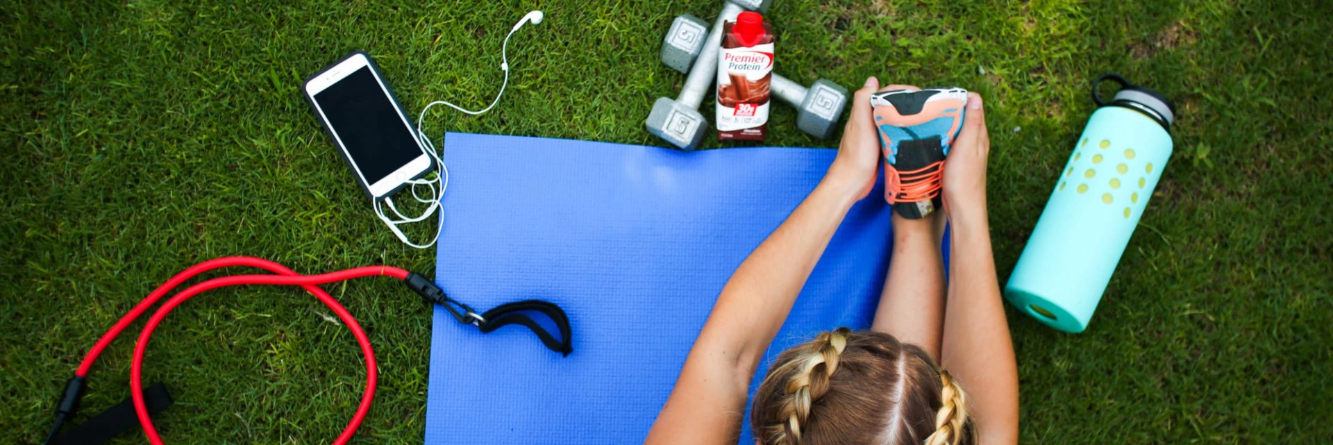 A person exercising with Premier Protein near.