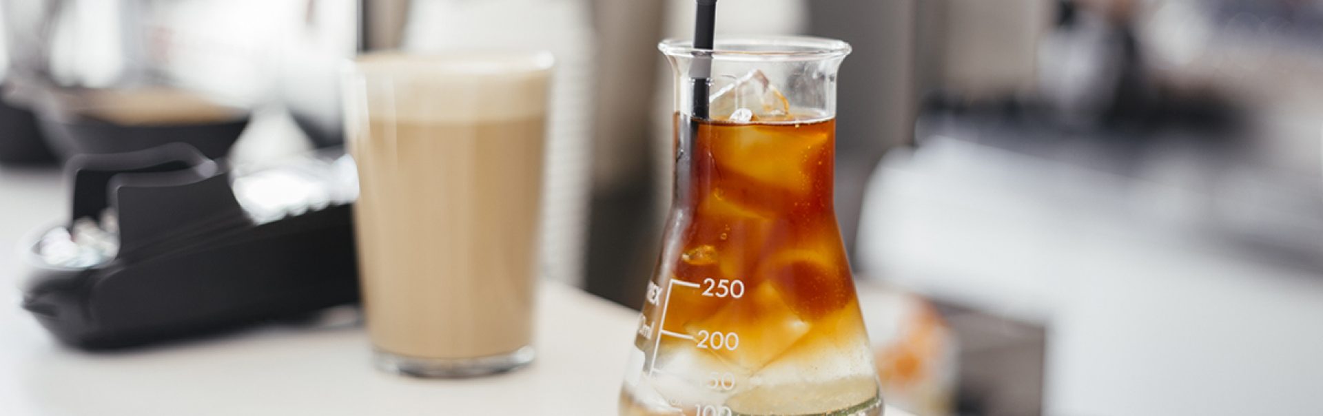 A photo of a protein shake being studied in a lab.