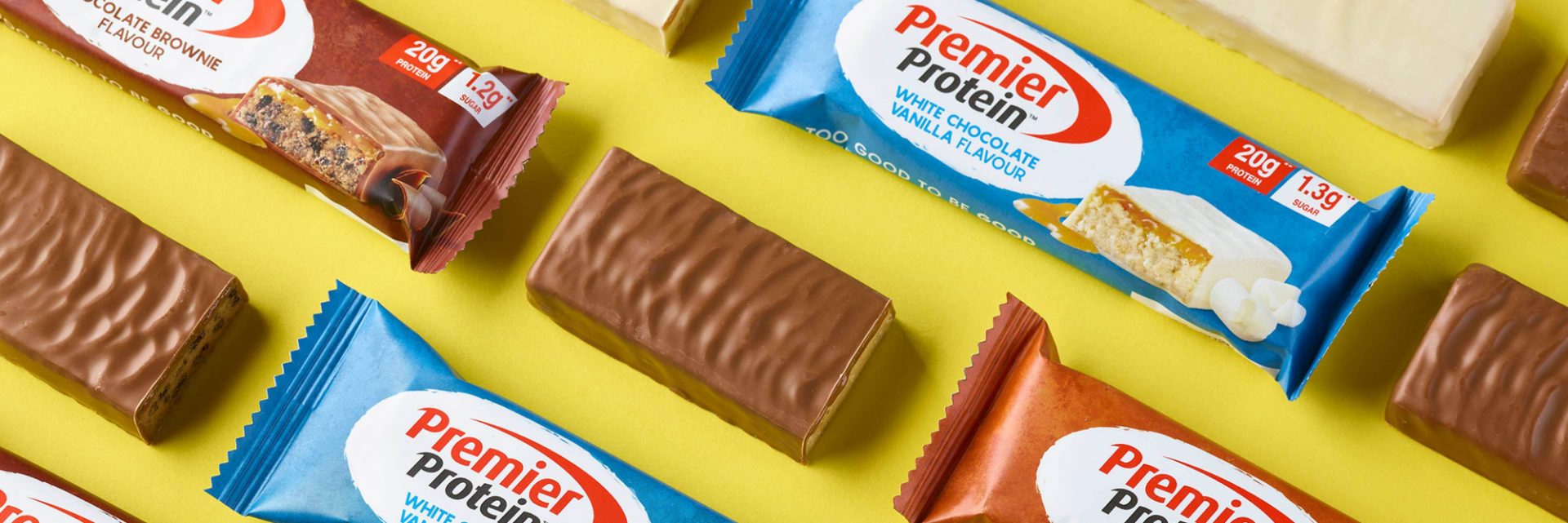 A number of wrapped and unwrapped Premier Protein bars.